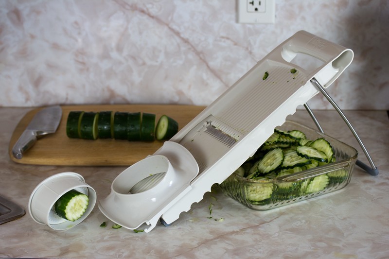 Slicing cucumbers with a mandoline